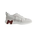 Stylish Hermès bouncing sneakers in black and white with red accents, perfect for modern fashion and.