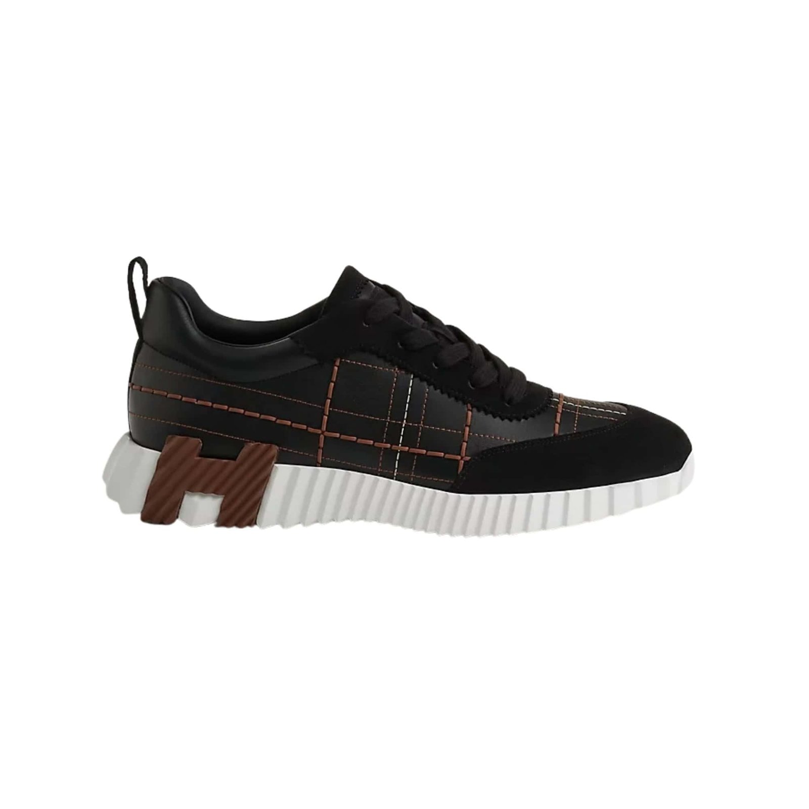 Stylish Hermès bouncing sneakers in black with orange stitching and unique sole design. Perfect for.